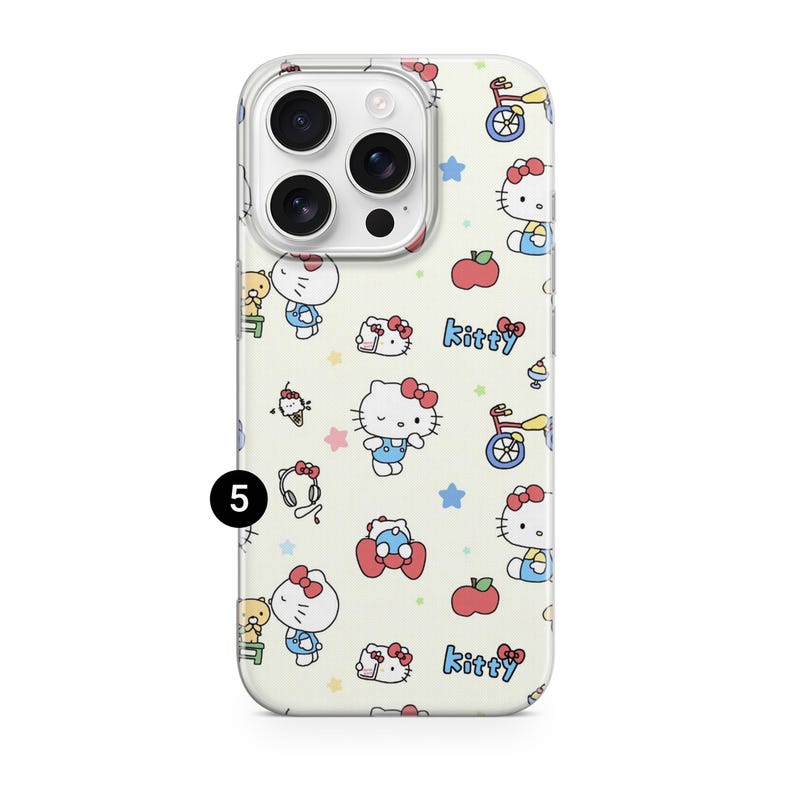 May include: A phone case with a repeating pattern of Hello Kitty characters, apples, stars, and bicycles on a cream background. The word "Kitty" is written in blue. The case has a clear border and a camera cutout.