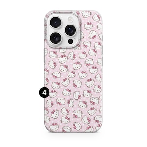 May include: A phone case featuring a repeating pattern of Hello Kitty faces with pink bows on a light pink background with white polka dots. The case has a clear border and a camera cutout.