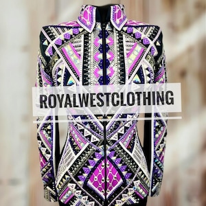 May include: A black and purple equestrian show jacket with intricate geometric patterns and sparkling embellishments. The jacket features a high collar, long sleeves, and a zipper closure. The text "ROYALWESTCLOTHING" is displayed across the front.
