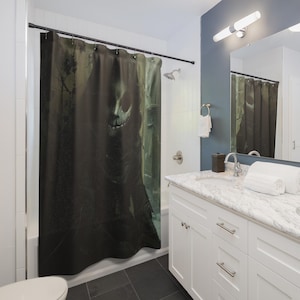 May include: A dark shower curtain featuring a skeletal figure with a menacing grin, set against a shadowy forest backdrop. The color palette is dominated by black, green, and gray tones, creating a spooky, Halloween-themed aesthetic.