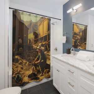 May include: Shower curtain featuring a vintage-style illustration of a gold rush scene. The artwork depicts miners, buildings, and a mountainous landscape in warm, earthy tones. The curtain adds a rustic and historical theme to a bathroom.