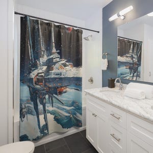 May include: A shower curtain featuring a futuristic space station design against a starry black backdrop. The artwork depicts a large, detailed spacecraft with illuminated sections, set above a landscape with blue and white hues. The curtain is hanging in a bathroom.
