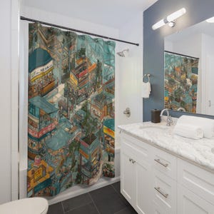 May include: A shower curtain featuring a detailed illustration of a bustling cityscape with colorful buildings, shops, and people. The artwork has a unique perspective, creating a sense of depth and urban life. The curtain is hung in a bathroom setting.