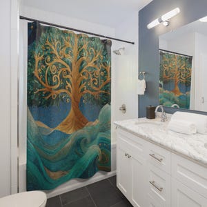 May include: A shower curtain featuring a stylized tree design. The tree has a golden trunk and branches with green leaves. The background is a gradient of blue and teal, with a wavy pattern at the bottom. The curtain is hanging in a bathroom.