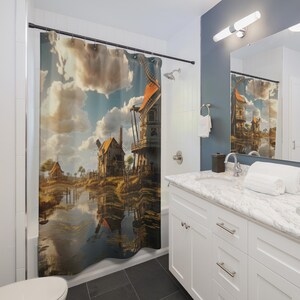 May include: A shower curtain featuring a scenic landscape with windmills, houses, and a body of water reflecting the sky and clouds. The artwork has a vintage, painterly style with warm, earthy tones.