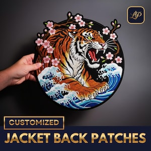 May include: Embroidered jacket back patch with a tiger design. The patch features a roaring tiger with orange and white fur, cherry blossoms, and ocean waves. The words "CUSTOMIZED JACKET BACK PATCHES" are displayed on the patch.