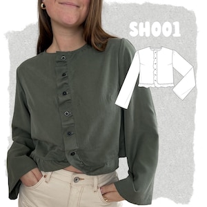 May include: An olive green long-sleeve button-down shirt with a round neckline, a ruffled front placket, and a ruffled hem. A white line drawing illustration of the shirt is displayed on the right side with the text SH001 above the drawing.