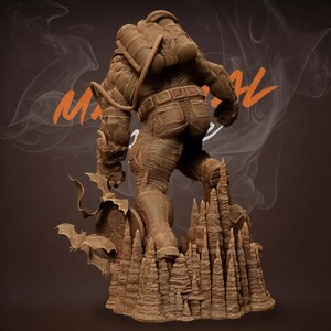 May include: A brown statue of a figure in a diving suit, standing on a rocky formation with bats. The figure has a backpack and is facing away from the viewer. The statue is detailed and textured, with a rugged appearance. The background has the word "MAGICAL" in orange.