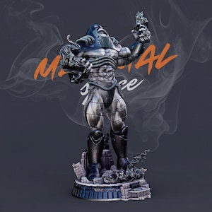 May include: A detailed statue of a muscular figure in a futuristic suit, holding a fiery object. The figure has a blue helmet and intricate cabling. The base features architectural details. The word "METAL" is visible in orange.