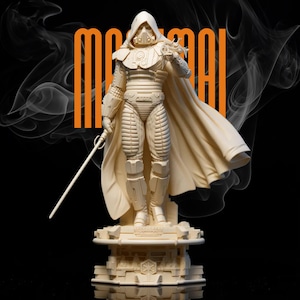 May include: A cream-colored statue of a robed figure holding a lightsaber, standing on a detailed pedestal. The figure wears a helmet and cape, with the word "MAROON" in orange vertical text. The background is black with white smoke.