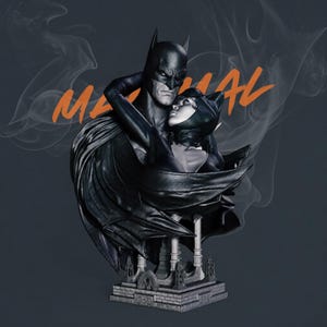May include: A detailed statue of Batman and Catwoman embracing, with Batman's cape draped around them. The figures are predominantly black and gray, with the word "MANUAL" in orange. The statue is set on a detailed base.