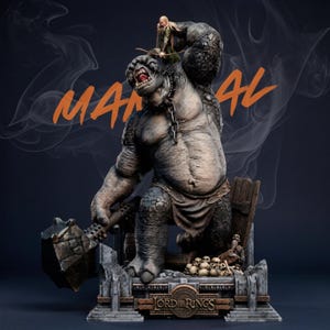 May include: A detailed statue of a troll from The Lord of the Rings, holding a large hammer. A small figure stands on the troll's head. The base features the Lord of the Rings logo and a pile of skulls. The word "MAN" and "AL" are written in orange.