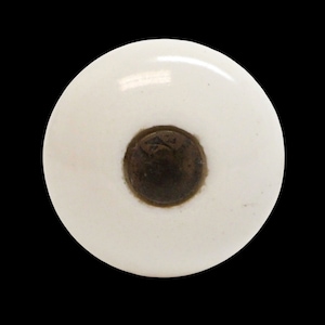 May include: White ceramic knob with a round, dark brown metal center.
