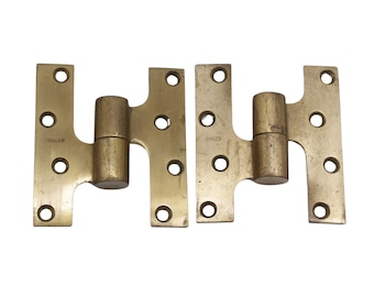 May include: Two antique brass hinges with the word "STANLEY" stamped on one and "STANLEY" stamped on the other.