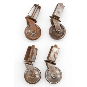 Set aus 4 geölten Stahlrollen