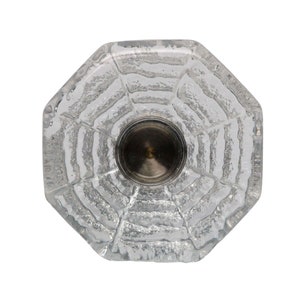May include: A clear glass octagonal knob with a textured surface and a silver metal center.
