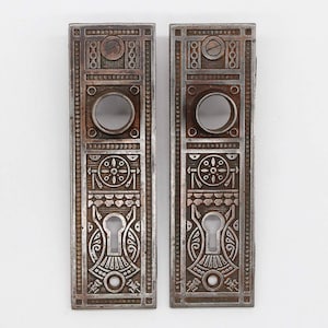 Pair of Antique 5.625 in. Aesthetic Cast Iron Passage Door Back Plates
