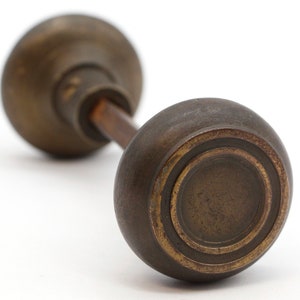 Pair of Vintage Concentric Patina Brass Passage Door Knobs