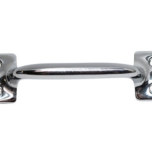 May include: A chrome-plated pull handle with two screw holes on each end. The handle is curved and has a smooth, polished finish.