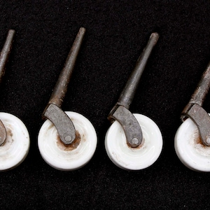 Set of Antique White Porcelain 1.625 in. Caster Wheels