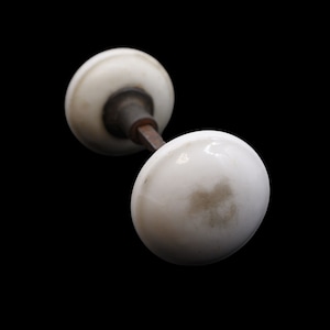 Pair of White Ceramic Door Knobs with Cast Iron Shanks