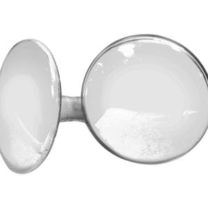 May include: Two clear glass bowls with a white powder inside. The bowls are connected by a metal stem.