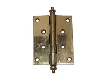 May include: A brass door hinge with a decorative knob on each end. The hinge has four screw holes on each side.