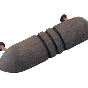 May include: A dark brown wooden cabinet pull with a rounded shape and a grooved design. The pull has two metal screws for attaching to a cabinet door.