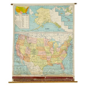 May include: A vintage map of the United States, showing state borders and major cities. The map is printed on a roll and has a wooden dowel at the top. The map is in shades of blue, green, yellow, and red.