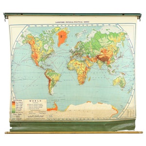 May include: A vintage world map on a roller, labeled "LANDFORM PHYSICAL-POLITICAL SERIES." The map features a detailed depiction of continents and oceans, with color-coded land elevations. The map is mounted on a green wooden frame with a wooden dowel at the bottom.