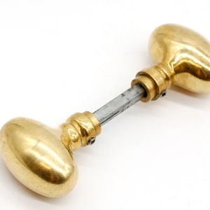 Pair of Polished Brass Fixed Oval Door Knobs