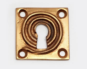 Modern 1.375 in. Square Swirl Brushed Brass Keyhole Cover