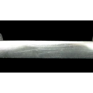 May include: A brushed metal cabinet pull with a rectangular bar and curved ends. The hardware is silver and appears to be made of stainless steel. The pull is designed for use on drawers or cabinet doors.