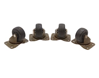 May include: Four black rubber swivel casters with metal plates. The casters are mounted on a white background.