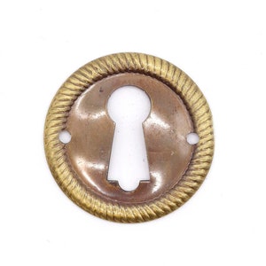 Vintage 1 in. Brass Keyhole Cover with Braided Detail