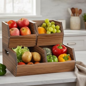 May include: A wooden tiered produce storage bin filled with fresh fruits and vegetables. Apples, grapes, bell peppers, and potatoes are visible. The bin is made of stained wood and sits on a countertop.