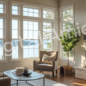 May include: A bright, airy living room with large windows overlooking a lake. The room features a fireplace, comfortable seating, a coffee table, and a large potted plant. The decor is neutral with warm wood flooring.