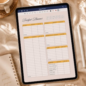 May include: A digital tablet displaying a budget planner template with a beige background and orange headers. The screen shows sections for income, expenses, savings, sinking funds, debt, and a summary. The text Budget Planner is at the top.