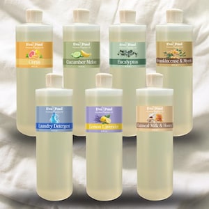 May include: Seven clear plastic bottles of Eva Paul fragrance oils. Each bottle has a different label with a fragrance name: Citrus, Cucumber Melon, Eucalyptus, Frankincense & Myrrh, Laundry Detergent, Lemon Lavender, and Oatmeal Milk & Honey.