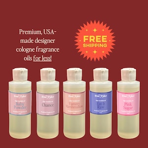 May include: Five clear glass cologne fragrance oil bottles with white caps and labels. The labels read "Baby Powder", "Chance", "Yummy Marshmallow", "Eat It Raw", and "Pink Sugar". The text "Premium, USA-made designer cologne fragrance oils for less!" is above the bottles.