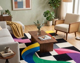 May include: A rectangular area rug featuring a bold geometric pattern with a black and white checkerboard base, accented by large, sweeping curved shapes in vibrant shades of blue, green, yellow, pink, and purple across the surface.