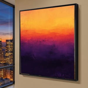 Puede incluir: Arte abstracto enmarcado. La obra presenta un degradado de colores, pasando de un naranja brillante en la parte superior a un púrpura intenso en la parte inferior. Los colores se mezclan suavemente, creando una pieza visualmente atractiva.