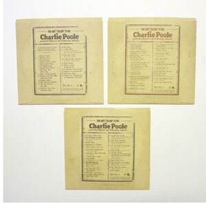 Backs of the CD sleeves with a list of songs for each.
