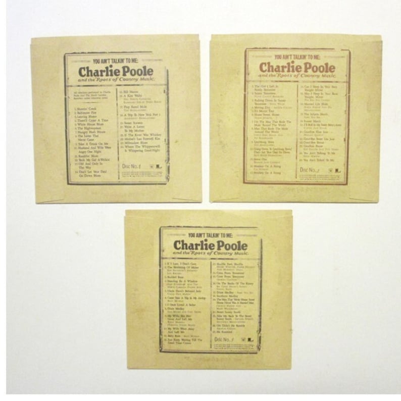 Backs of the CD sleeves with a list of songs for each.