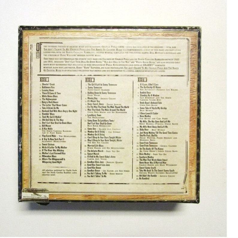 Back of box with some information and a list of songs.