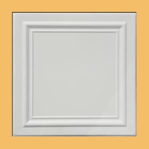 May include: A white, square cabinet door with a recessed panel and decorative molding. The door is set against a light orange background. The design features a raised, rectangular inner panel.