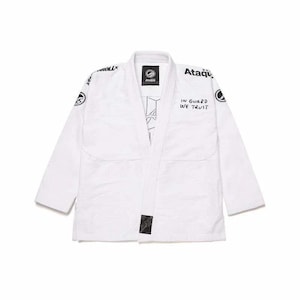 May include: A white Jiu-Jitsu gi with black text and logos. The gi features the text "IN GUARD WE TRUST" and the brand name "Ataque". The gi is made of a durable, heavyweight fabric.