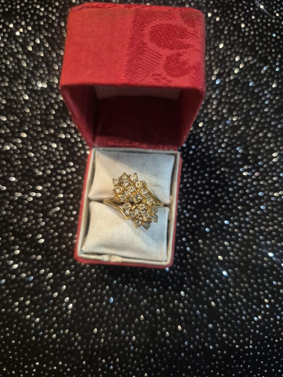 Waterfall cluster ring, characterized by multiple… - image 1