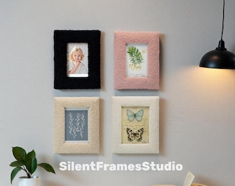 May include: Four framed pictures with fluffy, textured frames in black, pink, and cream. The frames display a child's photo, botanical prints, and butterfly illustrations. The text "SilentFramesStudio" is at the bottom.