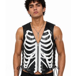 May include: Black leather vest featuring a white skeleton rib cage design. The vest has a zip closure and lace-up sides. A distinctive and edgy fashion item.